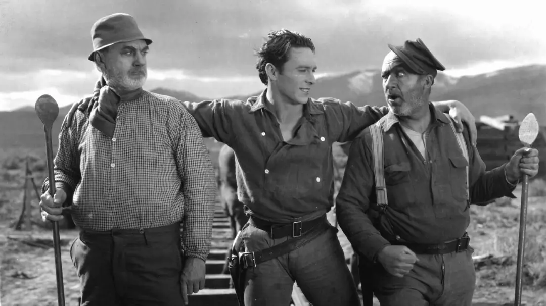 سه بازیگر مرد در صحنه فیلم‌برداری یکی از آثار جان فورد (John Ford)