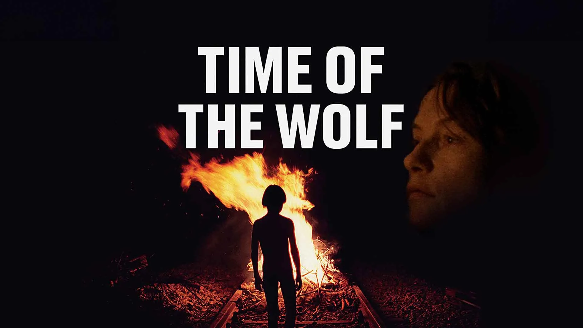 پسری مقابل آتش در پوستر فیلم Time of the Wolf