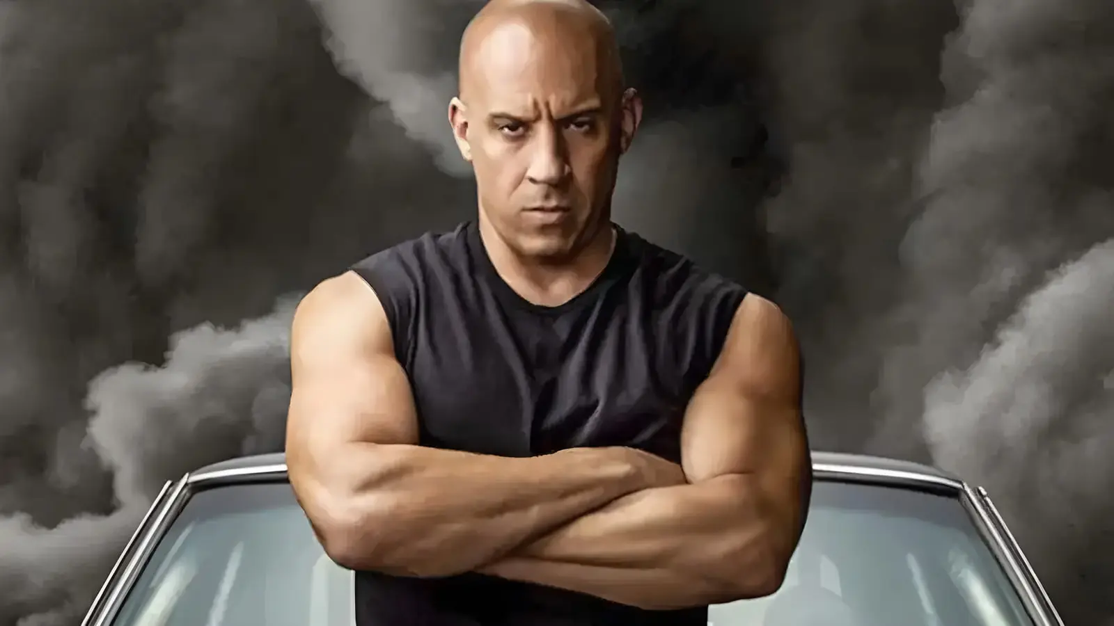 وین دیزل (Vin Diesel) با دست‌های گره‌خورده مقابل یک خودروی کلاسیک